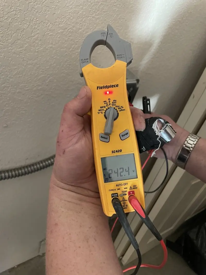 Voltage testing with clamp meter during Generator Installation in Milwaukee